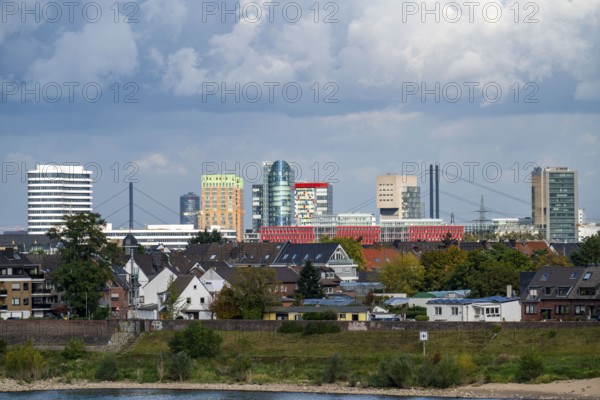 The skyline of Düsseldorf, with the skyscrapers in the Media Harbour, Rhine bridges, in front