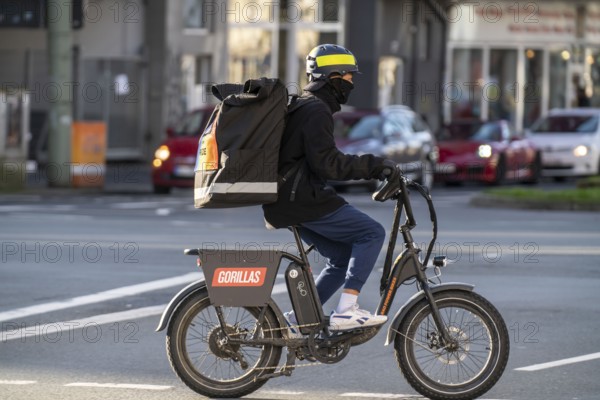 Bicycle courier from the fast delivery service Gorillas, delivers groceries, currently in over 20