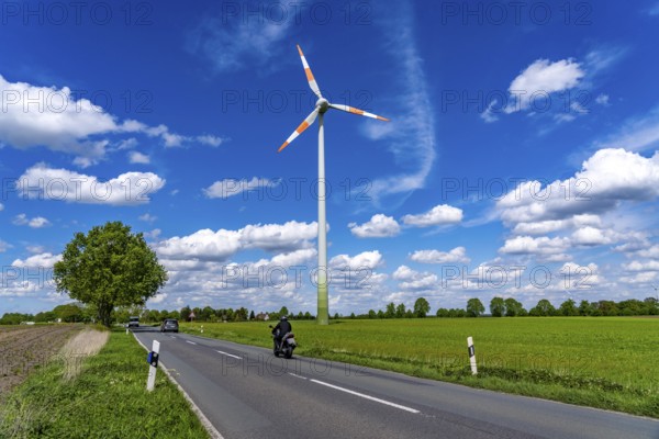 Wind turbine, wind energy plant from the manufacturer Enercon, blue sky with many white clouds,