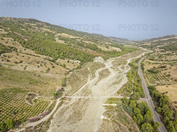 The dry riverbed of the Canale Raia, which is fed by the Torrente del Ferro torrent with water from