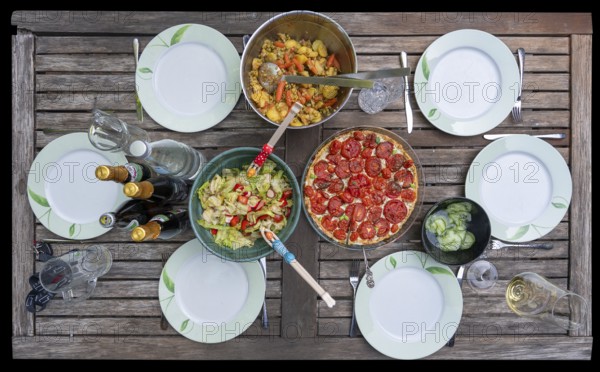 Garden table set with salads and a quiche, Bavaria, Germany, Europe