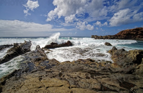 Lava rocks at the Playa de los Ciclos near the Green Lake, Lago Verde, El Golfo, Lanzarote, Canary
