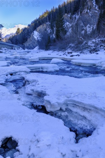 Inn or En near Scuol in winter, with ice floes, Engadin, Grisons, Switzerland, Europe