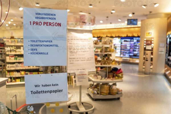 DM drugstore, signs at the entrance, no toilet paper, only one hygiene product per person, effects