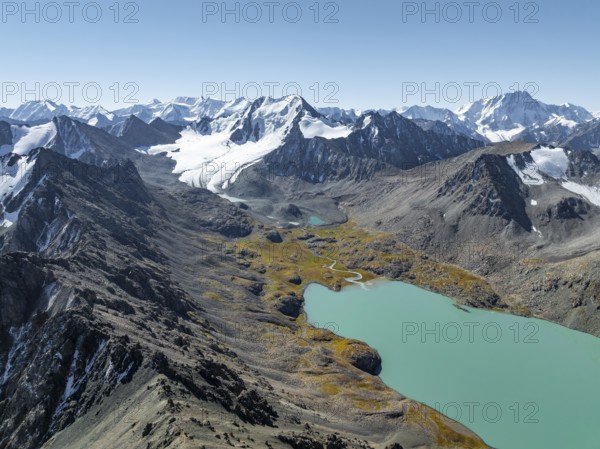 Mountain panorama, aerial view, 4000 metre peak with glacier, mountain pass and mountain lake