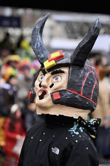 Person masked as a devil at the carnival parade of the Wey guild on Rose Monday, Güdismäntig,