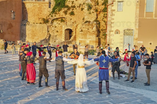 Group of people performing traditional Greek dance, Chania, Crete, Greek Islands, Greece, Europe
