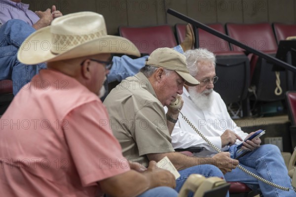 Oklahoma City, Oklahoma, Cattle buyers at an auction at the Oklahoma National Stockyards. Since it