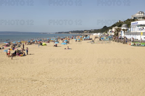 Holidaymakers on sandy beach near the Oceanarium, Bournemouth, Dorset, England, UK