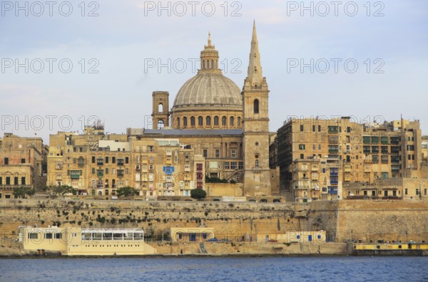 Soft evening light on buildings and churches Valletta, Malta, dome Basilica of Our Lady of Mount