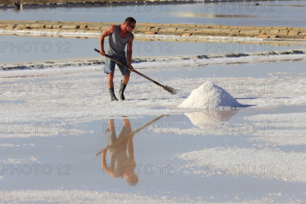 Workers in the salt pans of Trapani, Sicily, Italy, Europe