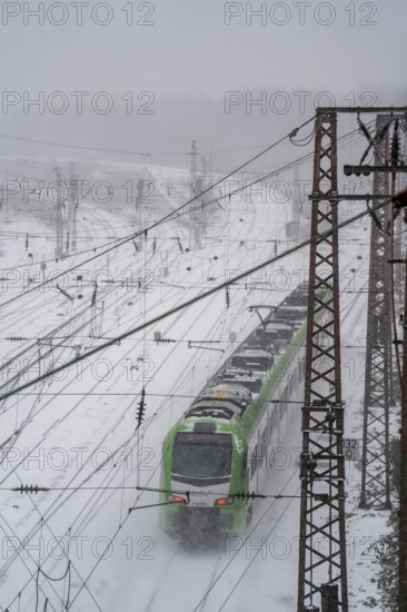 Onset of winter with lots of fresh snow and temperatures below -5 degrees during the day, railway