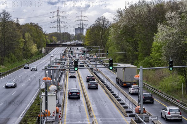 Weighing and barrier system on the A42 motorway, in front of the dilapidated motorway bridge over