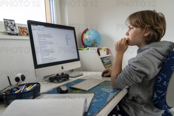 Young, primary school pupils, home learning, doing schoolwork, distance learning, virtual
