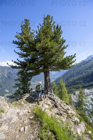 Hiker on the La Jonction hiking trail, Chamonix, Haute-Savoie, France, Europe