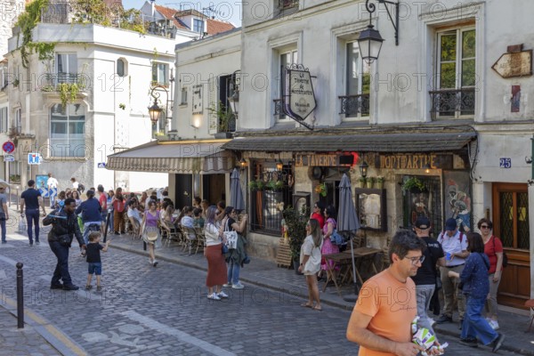 A lively café area in Montmartre, Paris with lots of people, Paris