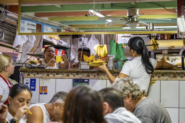 Waitress at a food stall, Mercado Central de San José, San José, Costa Rica, Central America
