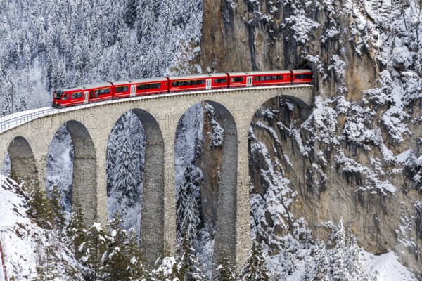 Rhaetian Railway train at the famous Landwasser Viaduct on the Albula railway Stadler Rail