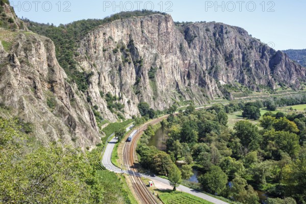 The Rotenfels with an Alstom Coradia LINT regional train operated by Vlexx in Traisen, Germany,