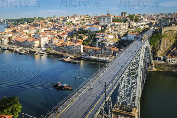 View of Porto city and Douro river and Dom Luis bridge I with metro tram from famous tourist