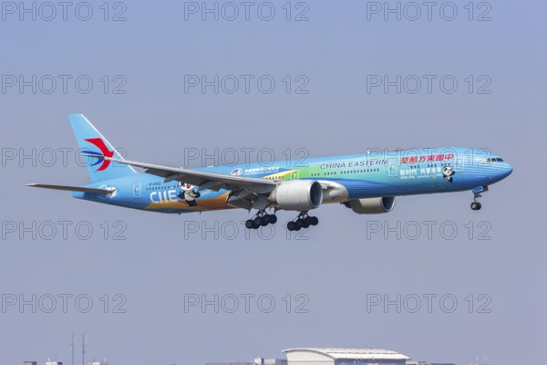 A Boeing 777-300ER aircraft of China Eastern with the registration B-2002 and the CIIE special