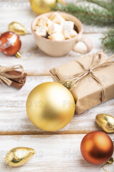 Christmas or New Year composition. Decorations, box, golden balls, cinnamon, fir and spruce