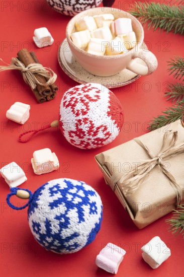 Christmas or New Year composition. Decorations, box, cinnamon, knitted balls, fir and spruce