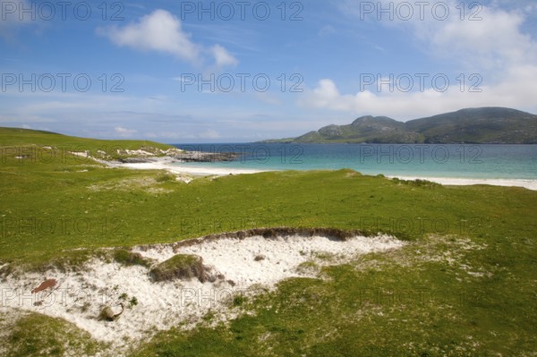 Machair grassland and sandy beach at Bagh a Deas, South Bay, Vatersay island, Barra, Outer