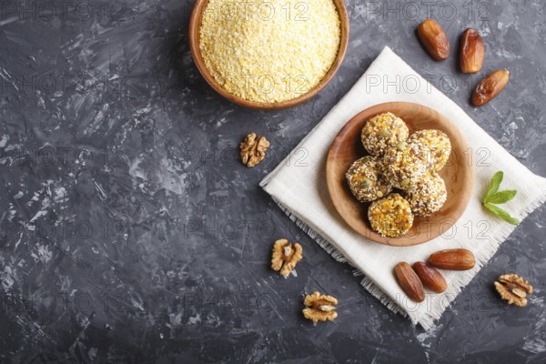 Energy ball cakes with dried apricots, sesame, cornflakes, linen, walnuts and dates with green mint
