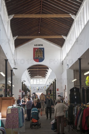 Shoppers inside the historic Shambles market hall in Devizes, Wiltshire, England, United Kingdom,