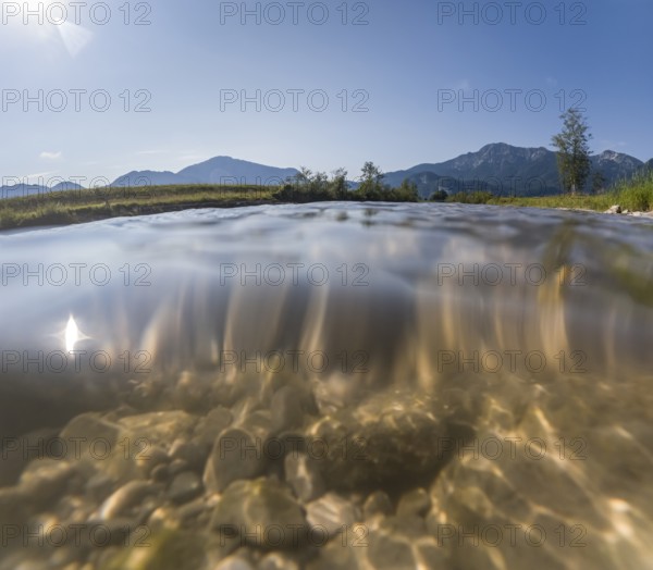 Underwater photograph of a river in front of mountains in sunlight, summer, Loisach, Schlehdorf,