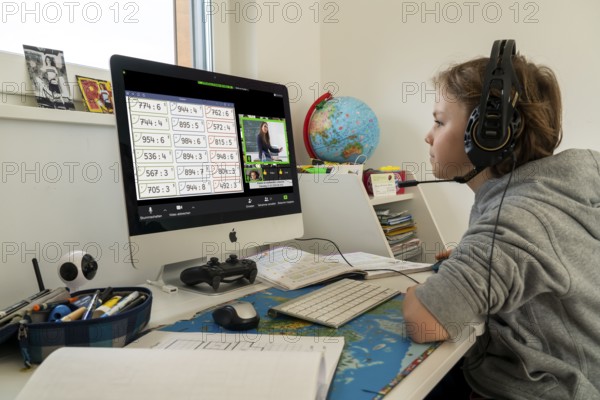 Young, primary school pupils, home learning, doing schoolwork, distance learning, virtual