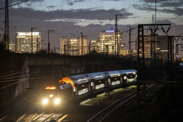 Skyline of Essen city centre, railway facilities in front of the main station, regional train,