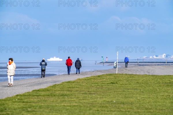 Dyke walk on the East Frisian coast near Norddeich, in the background the island of Norderney,
