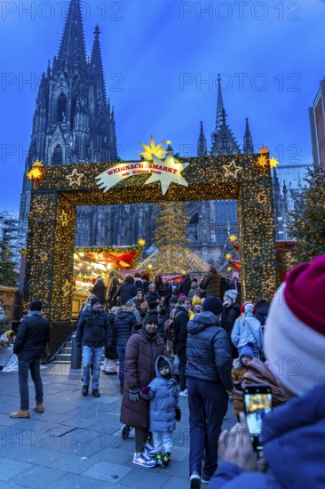 Christmas market at Roncalli Platz am Dom, in the city centre of Cologne, Sunday shopping in