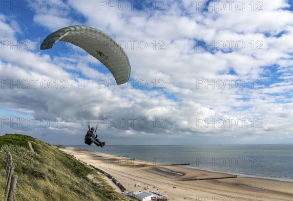 Paragliders along the dunes of Zoutelande, in Zeeland, South Holland, Netherlands