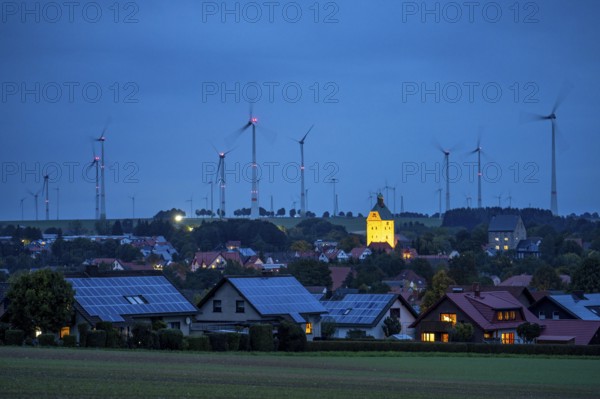 Wind farm above the village of Lichtenau, self-proclaimed energy town, houses with photovoltaic