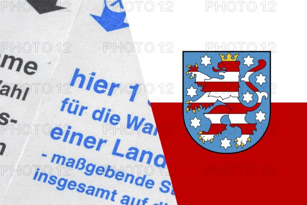 Symbolic image of the state election in Thuringia: Flag of Thuringia and close-up of a ballot paper