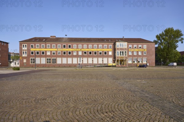 Former post office, blue cloudless sky, tree, town hall square, Wilhelmshaven, independent city,