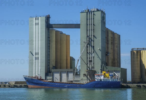 Loading of grain from silo to ship in Ystad harbour, Skåne County, Baltic Sea, Sweden, Scandinavia,
