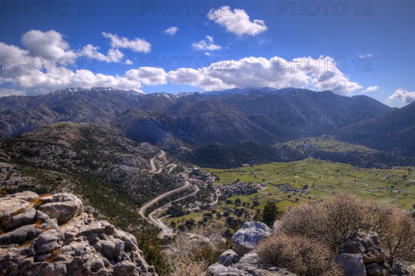 Mountainous landscape with serpentines, meadows and settlements, partially shaded, Askifou plateau,