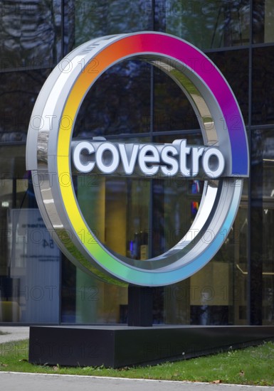 Covestro AG, company logo in front of the corporate headquarters at dusk, Leverkusen, Bergisches