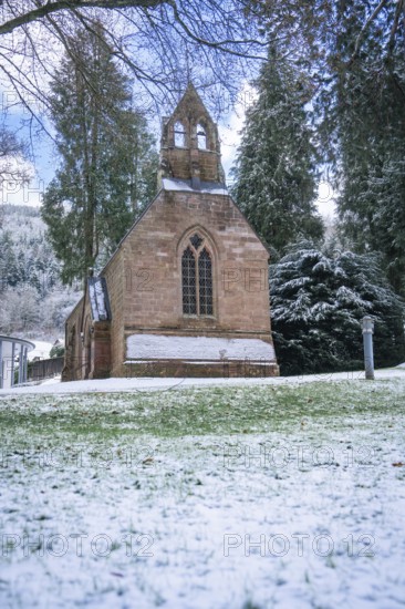 A snow-covered church surrounded by trees under a clear sky, English Church, spa garden, Bad