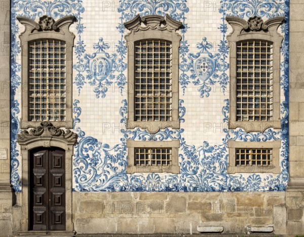 The facade of Igreja do Carmo church, adorned with intricate blue and white tiles, Porto, Portugal,