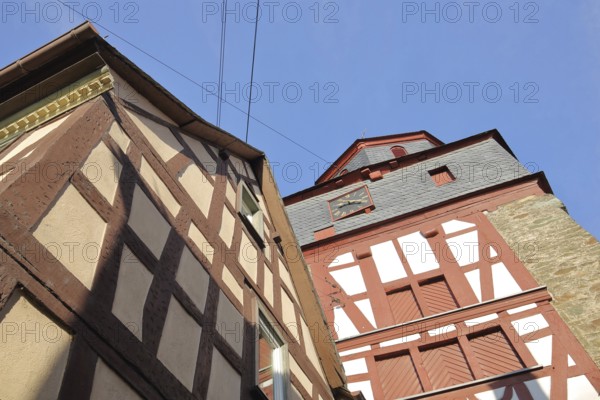 Bell tower of the Protestant church and half-timbered house, view upwards, Runkel, Westerwald,