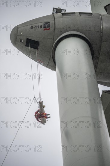 Height rescuers from the Oberhausen professional fire brigade practise abseiling from a wind