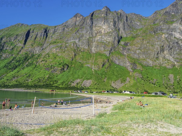 Beach Ersfjordstranden, fjord Ersfjord, public recreation area, beach volleyball, view to mountain