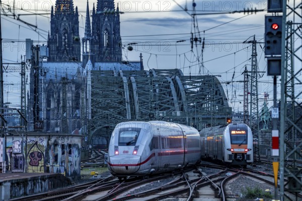 ICE train on the track in front of Cologne Central Station, Hohenzollern Bridge, Cologne Cathedral,