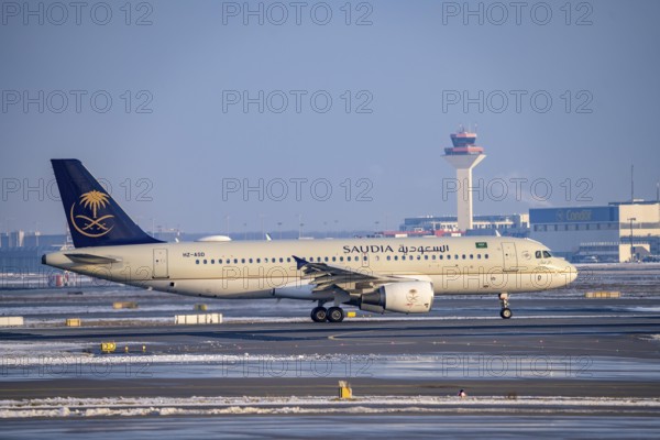 Saudia Airbus A320-200 on the way to Runway West, Frankfurt Airport FRA, Fraport, in winter, Hesse,