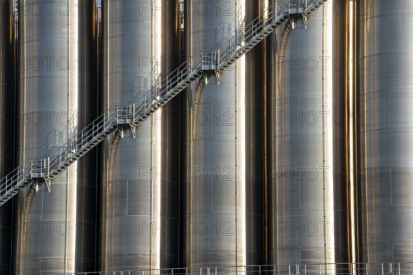 Stainless steel tanks of a large silo facility in Duisburg inland harbour, Duisburg-Neuenkamp, for